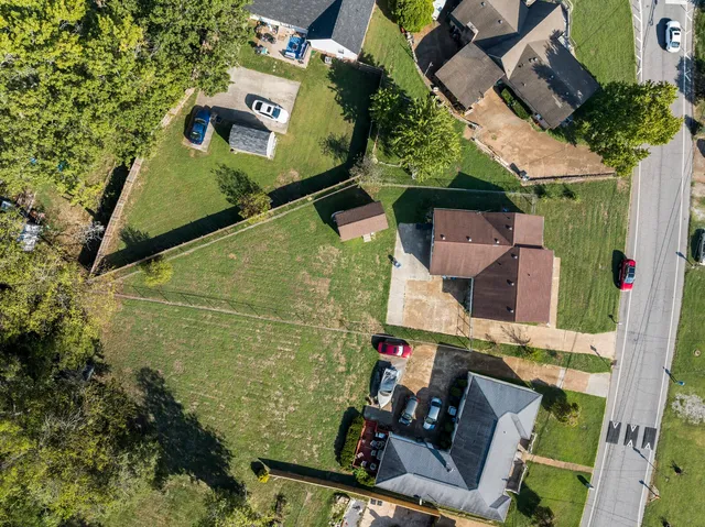 an aerial view of a house with outdoor space