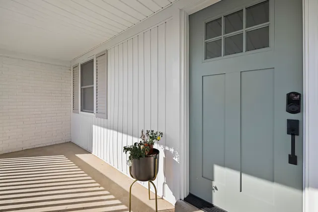a hallway with a white walls
