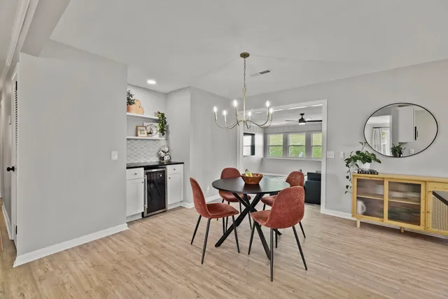 a view of a dining room with furniture and wooden floor