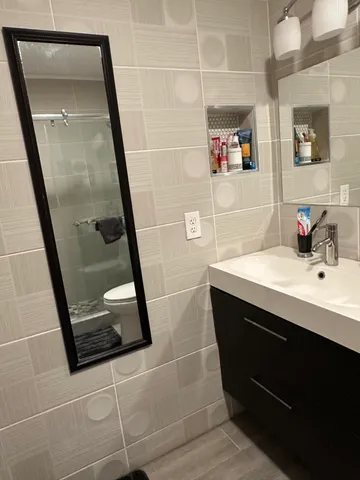 a bathroom with a sink and mirror