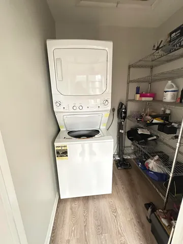 a view of a house with a big yard and potted plants