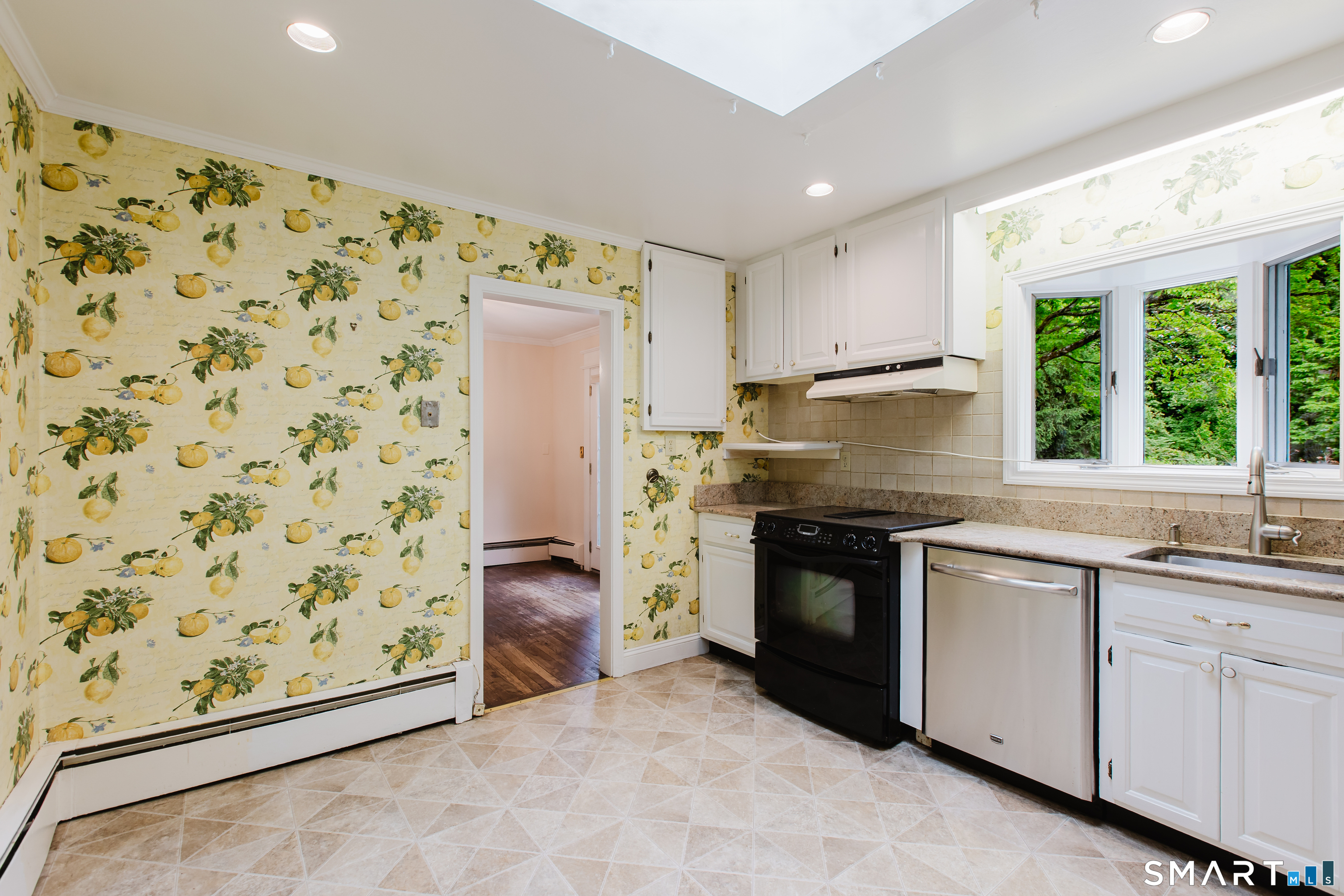 75 Westwood Road Stamford, CT 06902 - Photo 13 of 40 Eat-in Kitchen features large skylight & triple window overlooking beautiful backyard