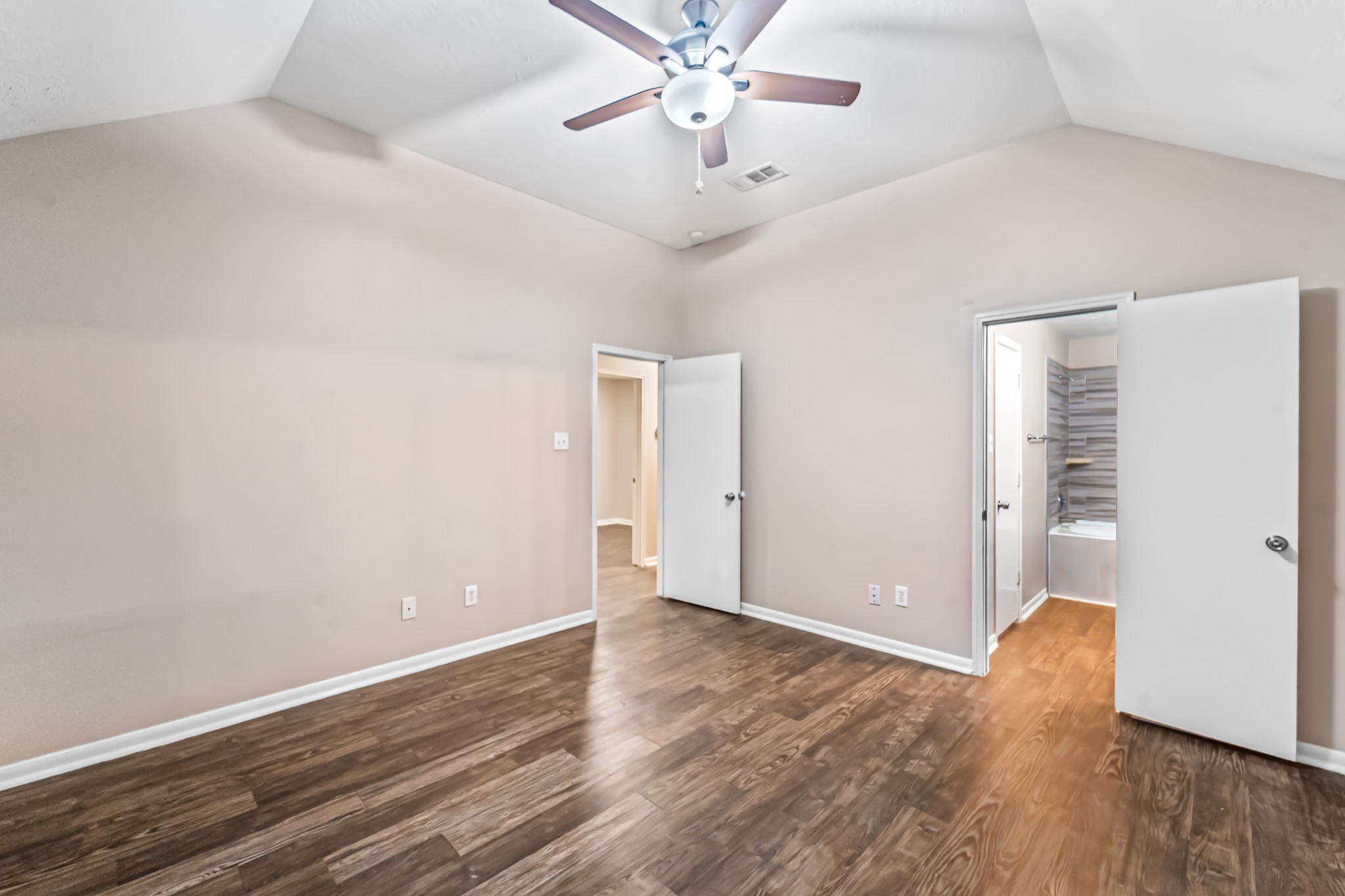 6827 Highwind Bend Lane Katy, TX 77449 - Photo 12 of 20 a view of an empty room with wooden floor