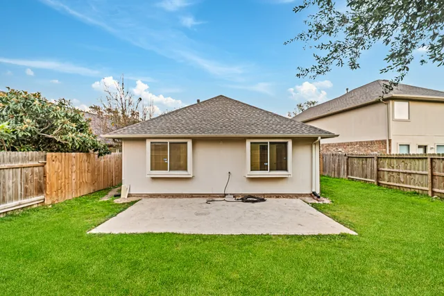 a front view of a house with a yard and porch