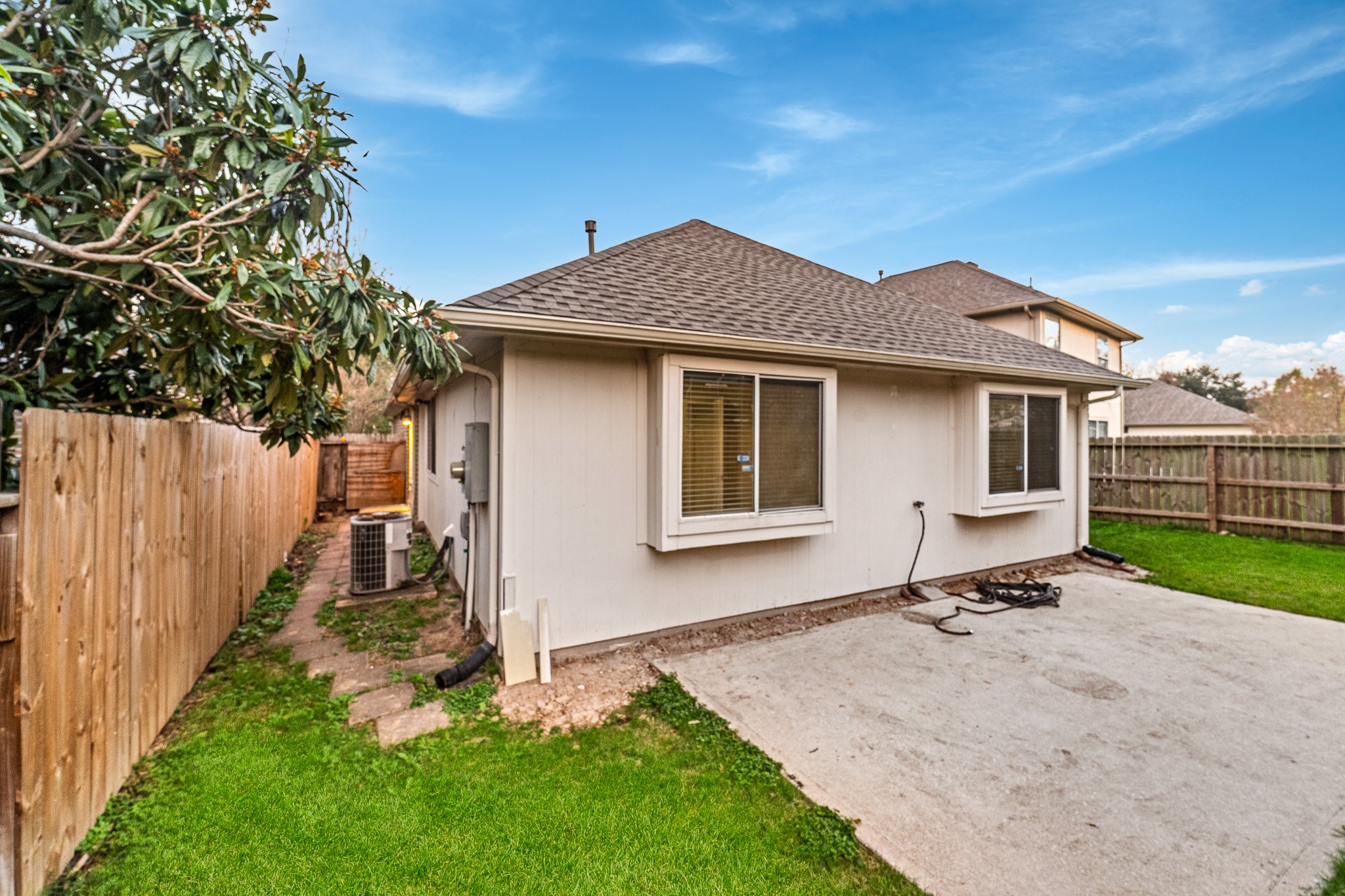 6827 Highwind Bend Lane Katy, TX 77449 - Photo 19 of 20 a backyard of a house with seating space