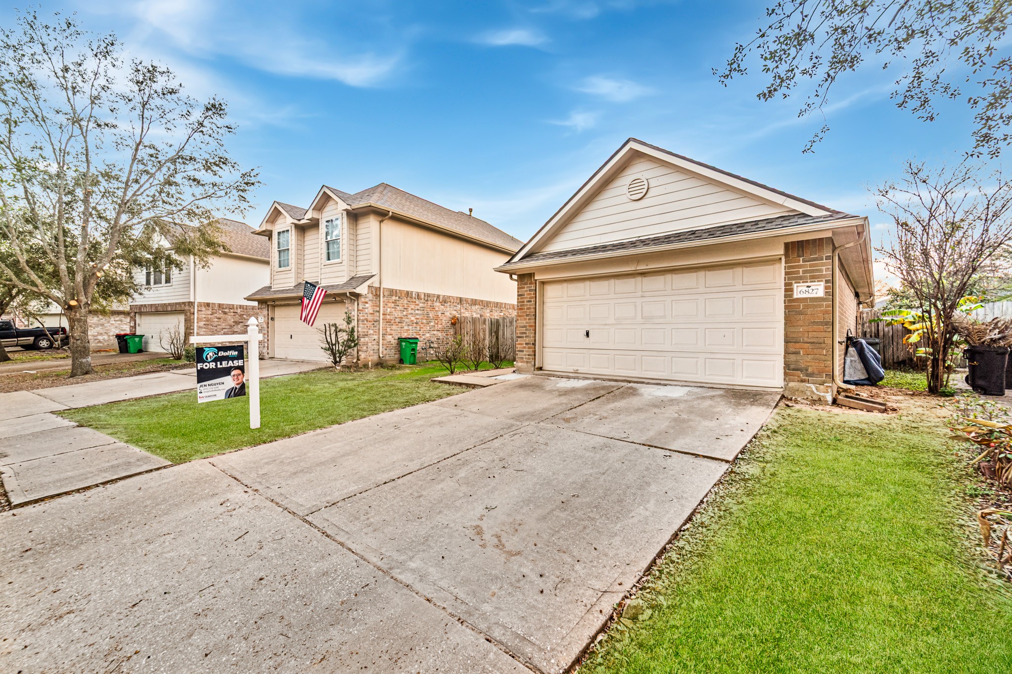 6827 Highwind Bend Lane Katy, TX 77449 - Photo 2 of 20 a front view of a house with a yard and garage