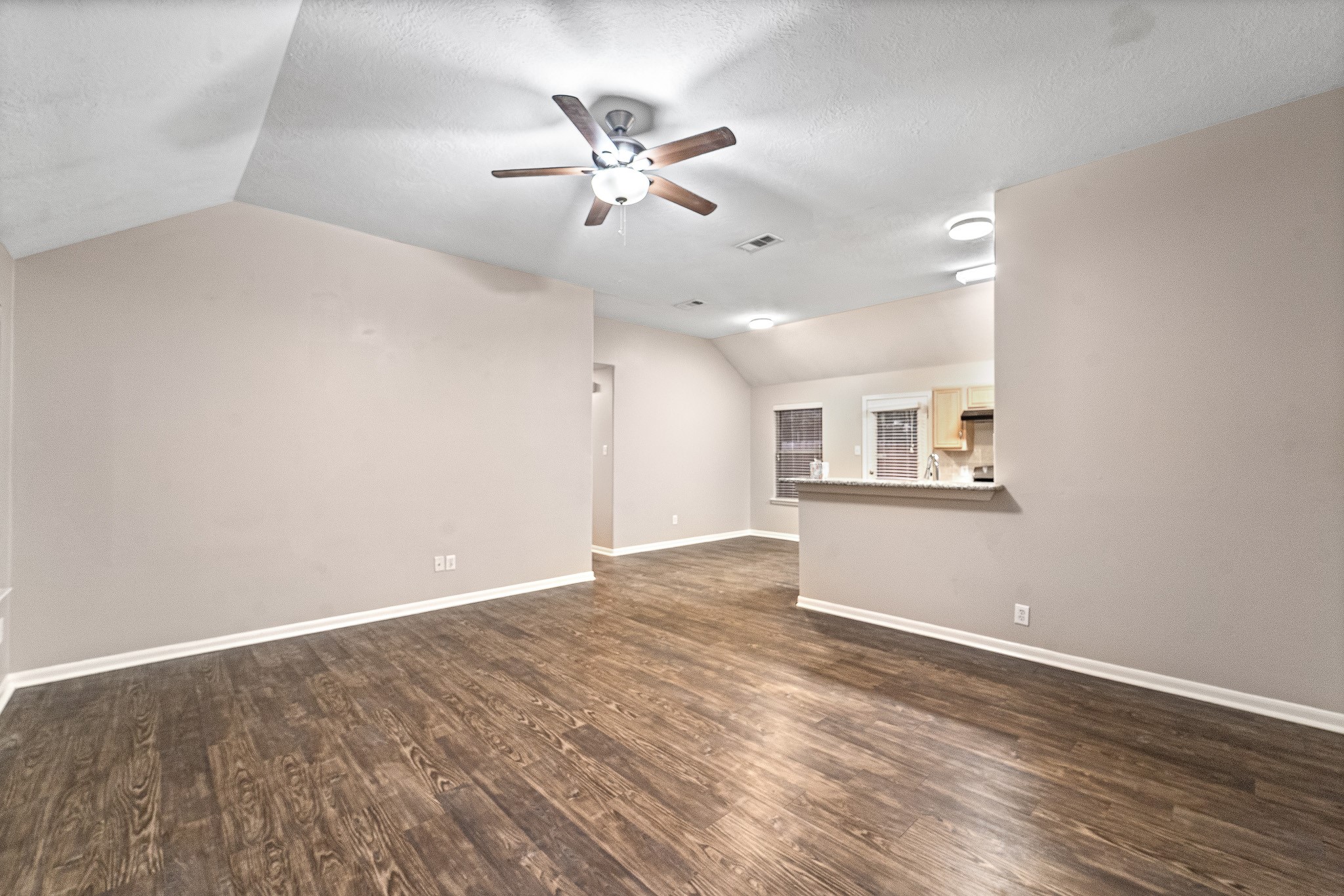 6827 Highwind Bend Lane Katy, TX 77449 - Photo 5 of 20 a view of an empty room with a chandelier fan