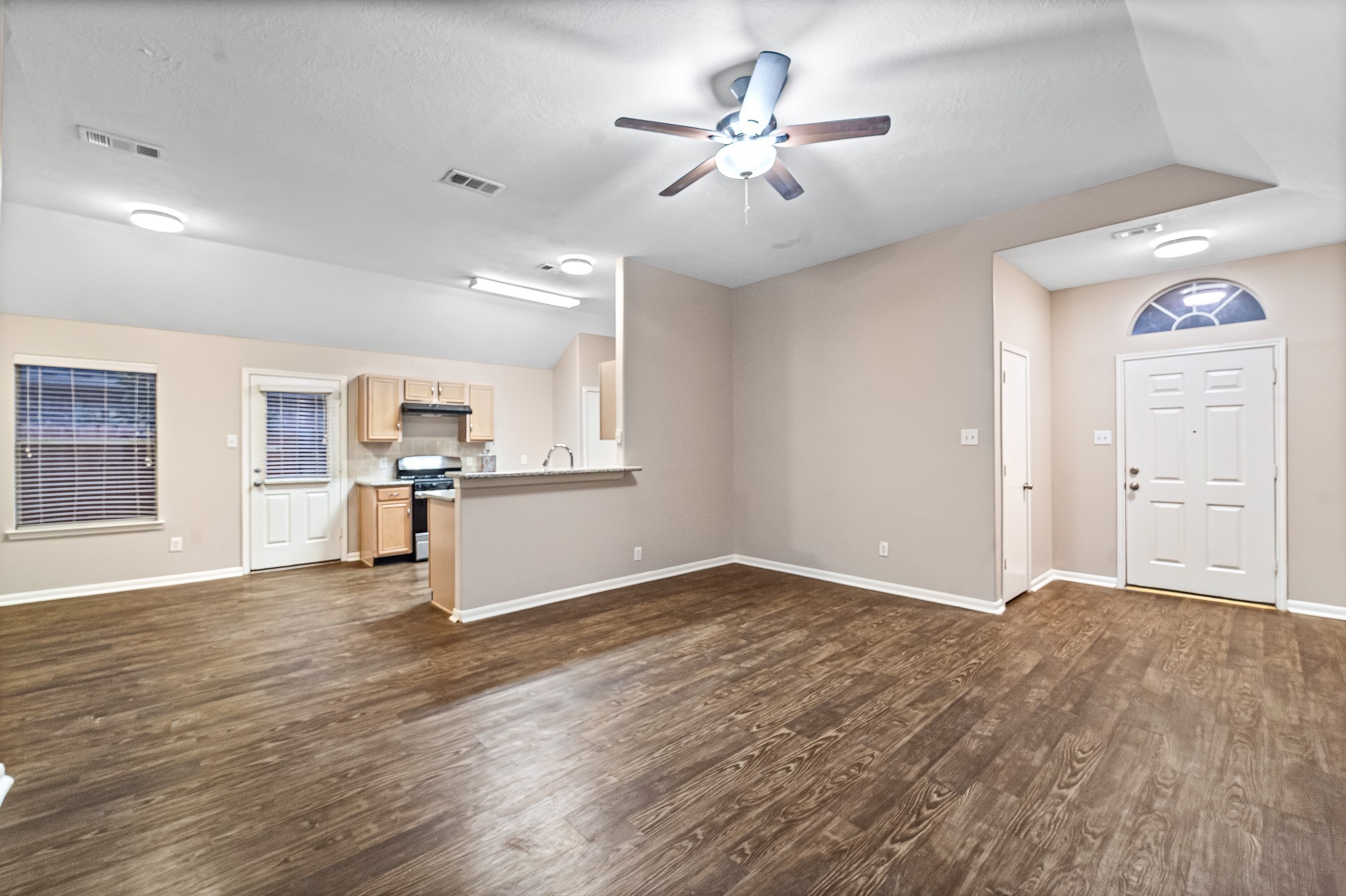 6827 Highwind Bend Lane Katy, TX 77449 - Photo 6 of 20 a view of empty room with wooden floor and window