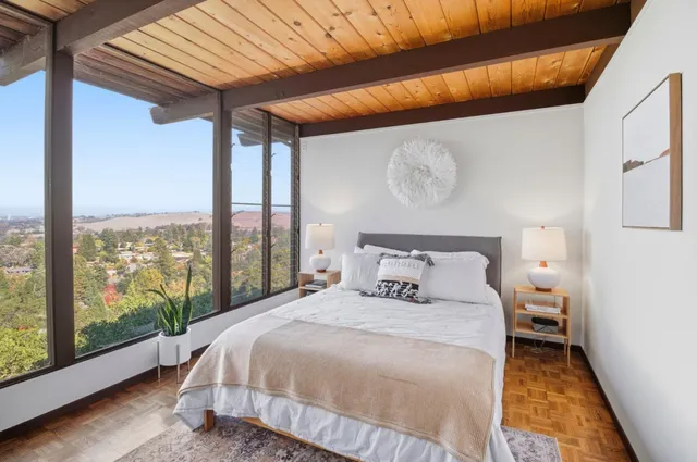 a bedroom with a bed and window