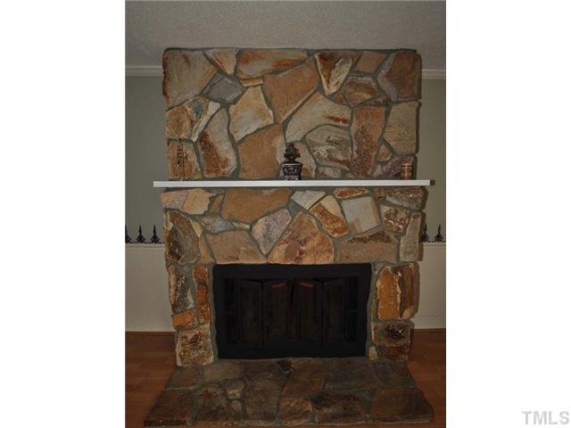 7913 Mourning Dove Road Raleigh, NC 27615 - Photo 9 of 12 stone fireplace