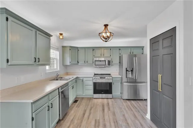 a kitchen with a stove and a refrigerator