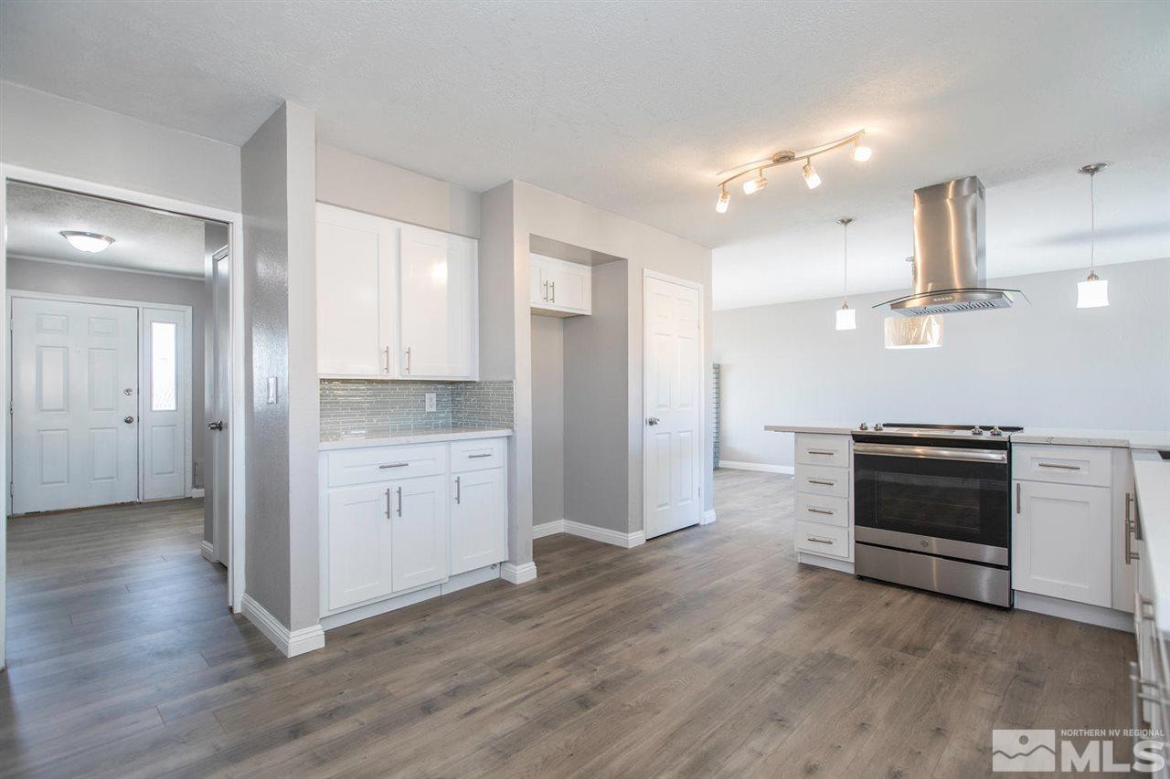 425 Hoge Road Reno, NV 89506 - Photo 8 of 25 a open kitchen with white cabinets and stainless steel appliances