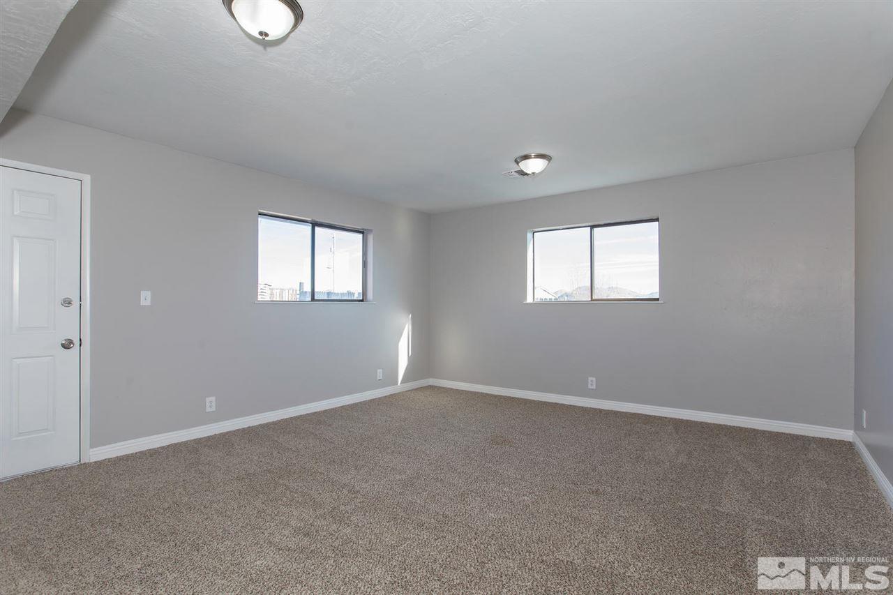425 Hoge Road Reno, NV 89506 - Photo 9 of 25 a view of an empty room with windows