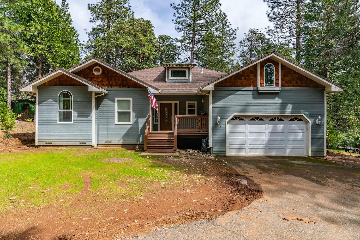 26878 Crawley Lane Pioneer, CA 95666 - Photo 1 of 1 a front view of a house with yard and trees in the background
