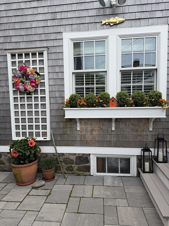 31 Franklin Street Marblehead, MA 01945 - Photo 26 of 35 a potted plant sitting in front of a house