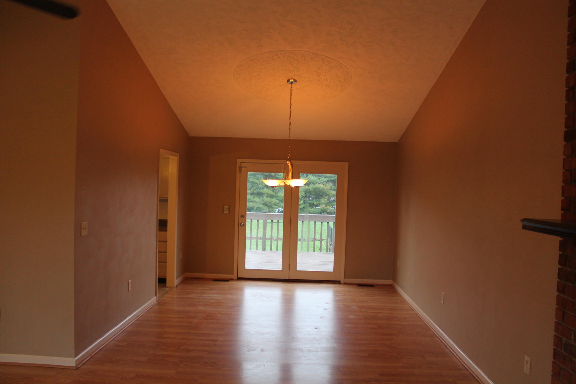 201 Aftons Meadow Road Vinton, VA 24179 - Photo 3 of 18 a view of an empty room with wooden floor and a window