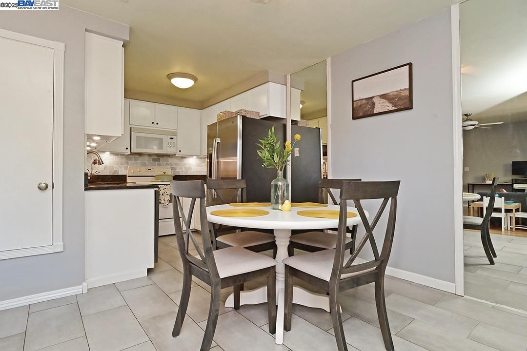 1031 Spring Valley Common Livermore, CA 94551 - Photo 11 of 26 a dining room with furniture and window