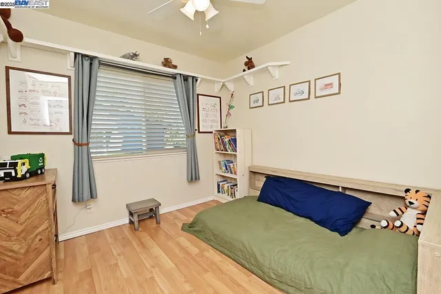 a bedroom with a bed and a table in it