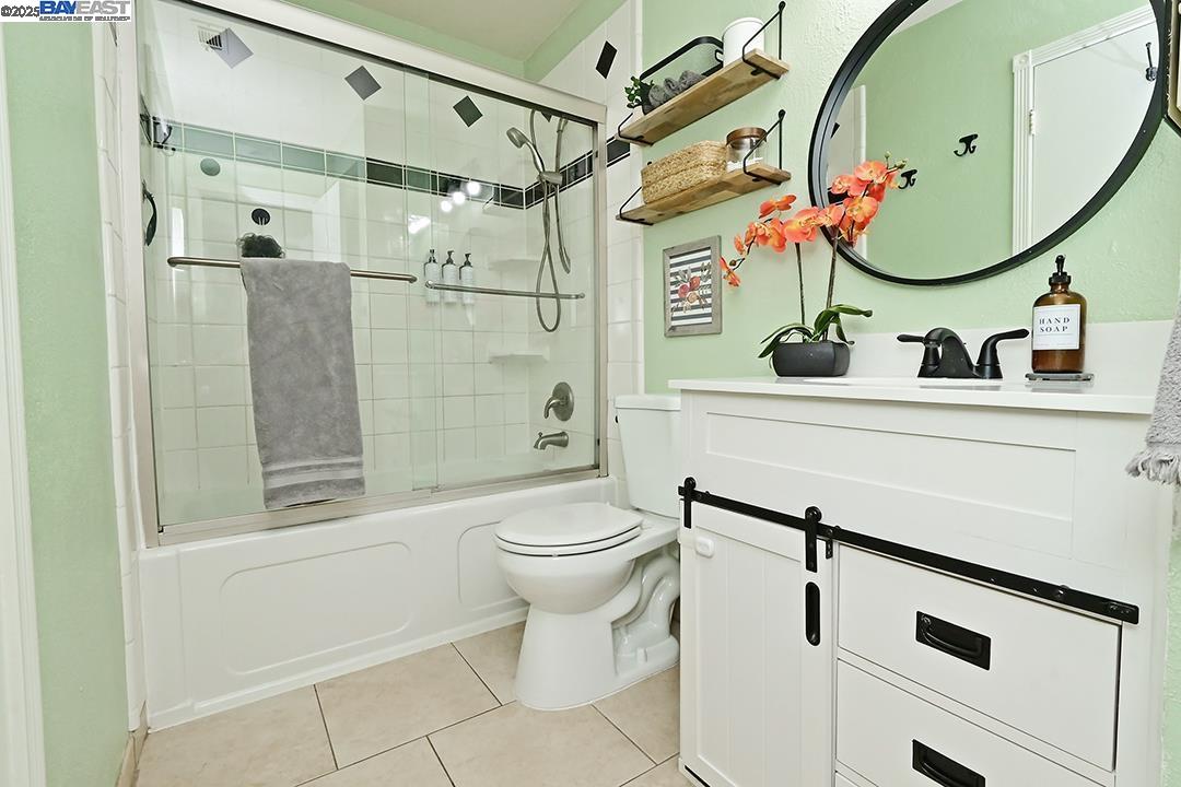 1031 Spring Valley Common Livermore, CA 94551 - Photo 17 of 26 a bathroom with a sink mirror toilet and shower