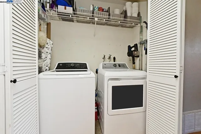a utility room with dryer and washer