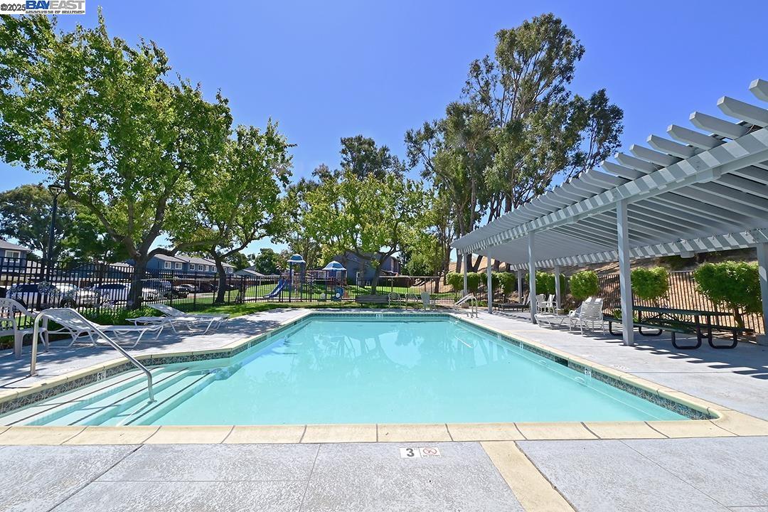 1031 Spring Valley Common Livermore, CA 94551 - Photo 20 of 26 a view of a swimming pool with sitting area and furniture