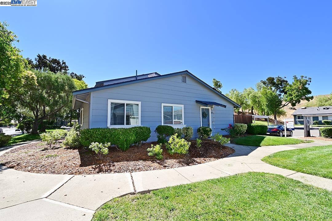 1031 Spring Valley Common Livermore, CA 94551 - Photo 26 of 26 a front view of a house with a yard