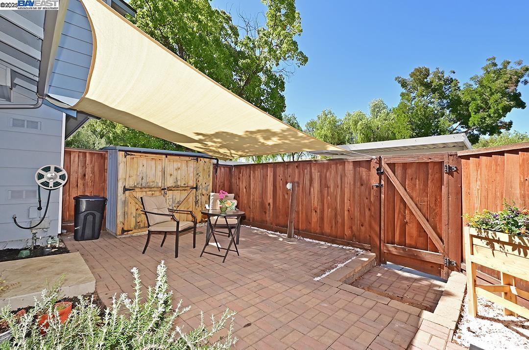 1031 Spring Valley Common Livermore, CA 94551 - Photo 3 of 26 a view of a patio with a table and chairs