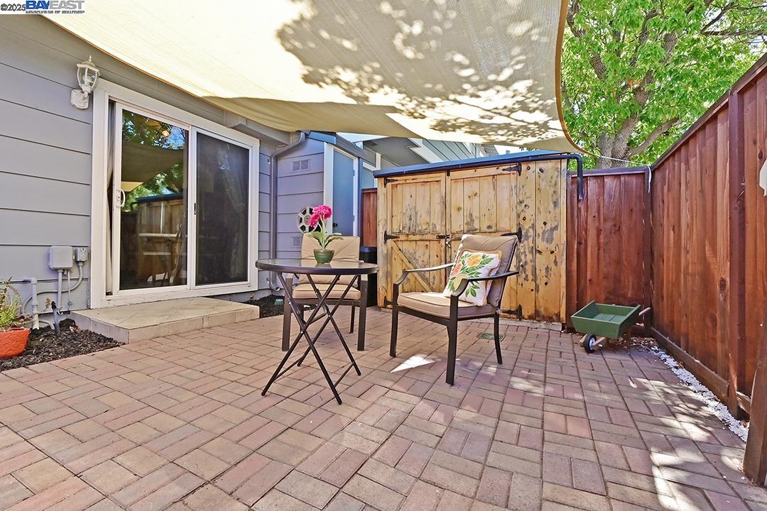 1031 Spring Valley Common Livermore, CA 94551 - Photo 4 of 26 a patio with table and chairs