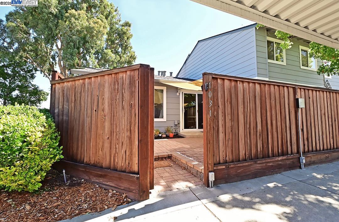 1031 Spring Valley Common Livermore, CA 94551 - Photo 5 of 26 a view of a house with backyard and wooden fence
