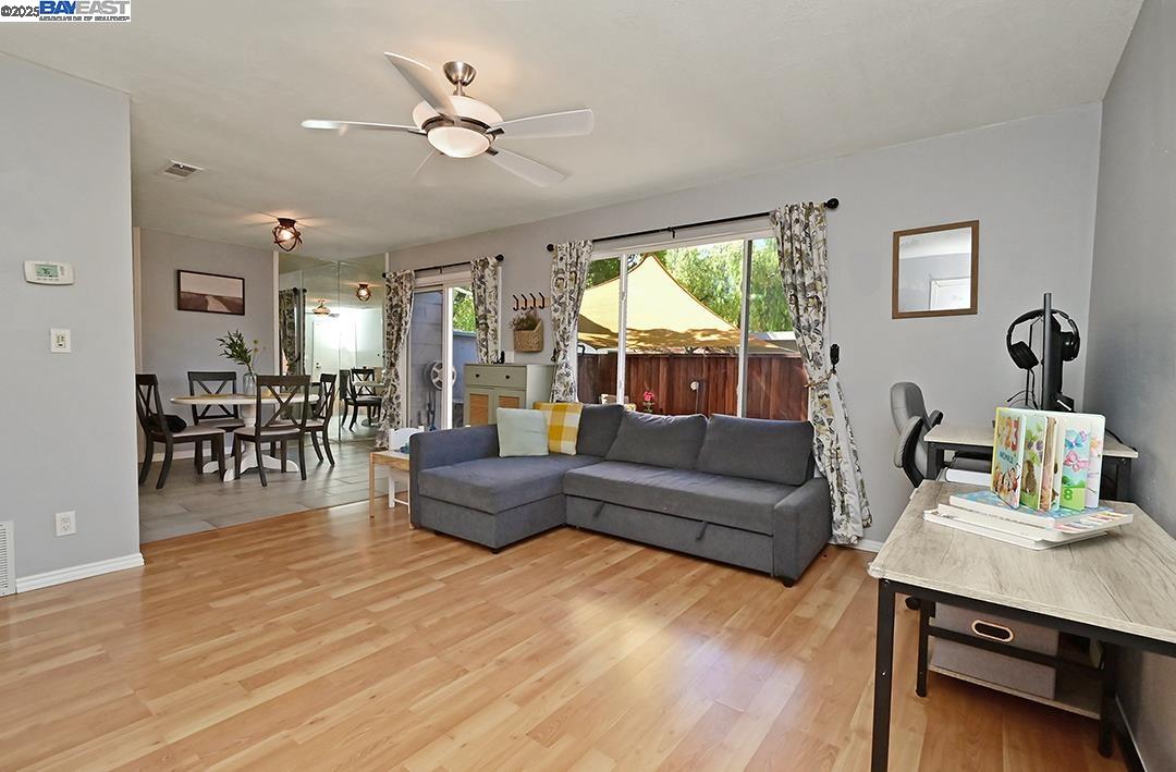 1031 Spring Valley Common Livermore, CA 94551 - Photo 7 of 26 a living room with furniture and a large window