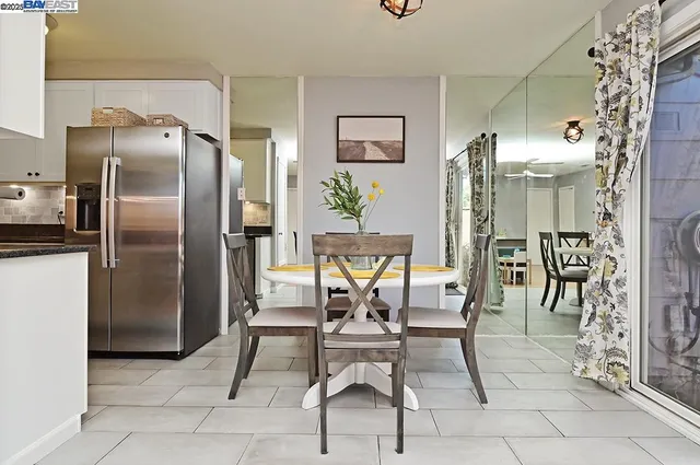 a patio with a table and chairs