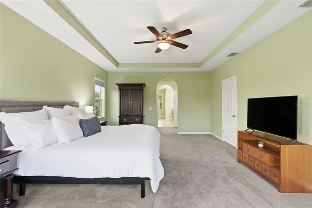 a front view of a house with plants