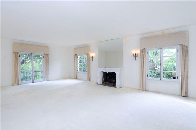 1098 Golf Road Santa Barbara, CA 93108 - Photo 3 of 9 a view of an empty room with a fireplace and a window