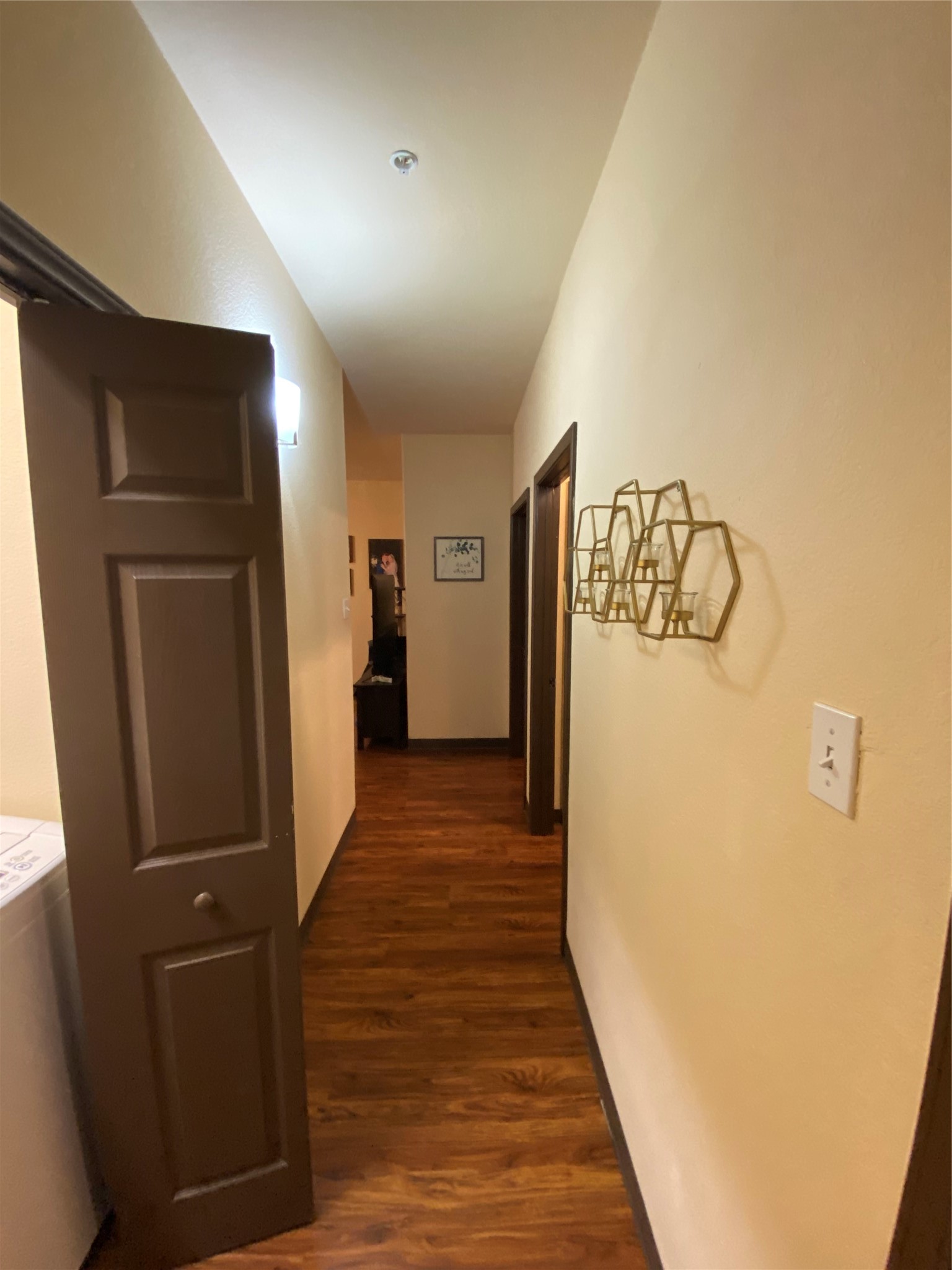 1239 20th Street, Unit B Huntsville, TX 77340 - Photo 11 of 17 a view of a hallway with wooden floor