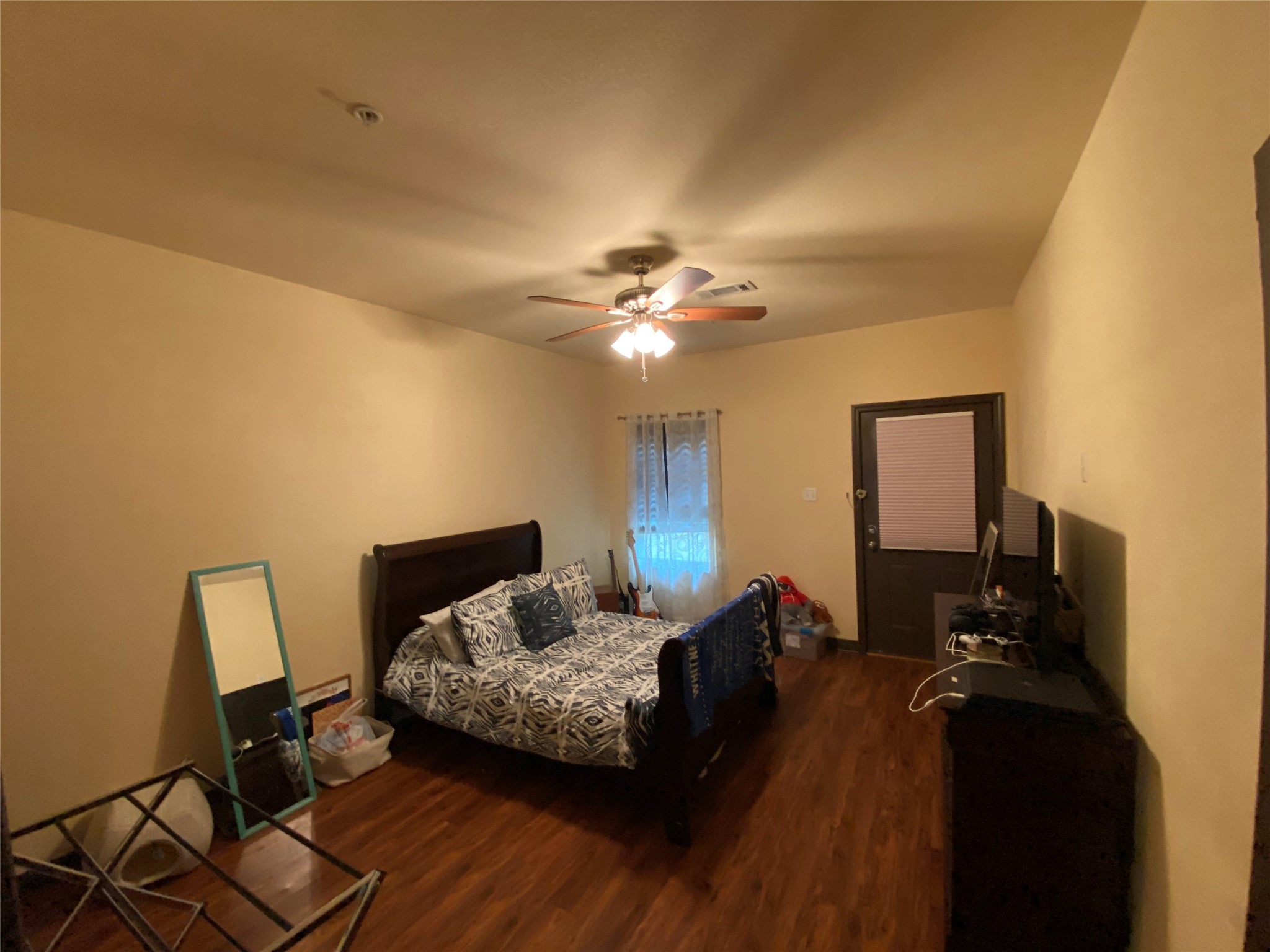 1239 20th Street, Unit B Huntsville, TX 77340 - Photo 13 of 17 a living room with furniture and a chandelier