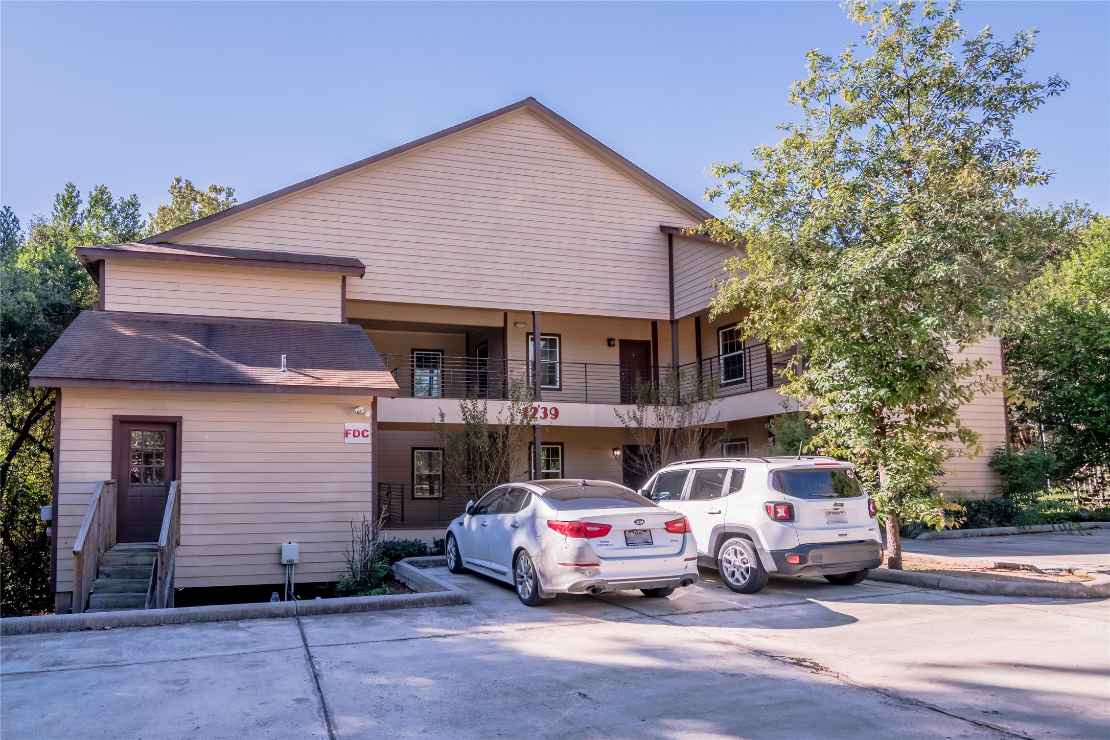 1239 20th Street, Unit B Huntsville, TX 77340 - Photo 3 of 17 a car parked in front of a house
