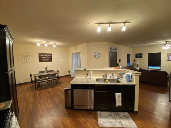 a kitchen with counter top space and stainless steel appliances
