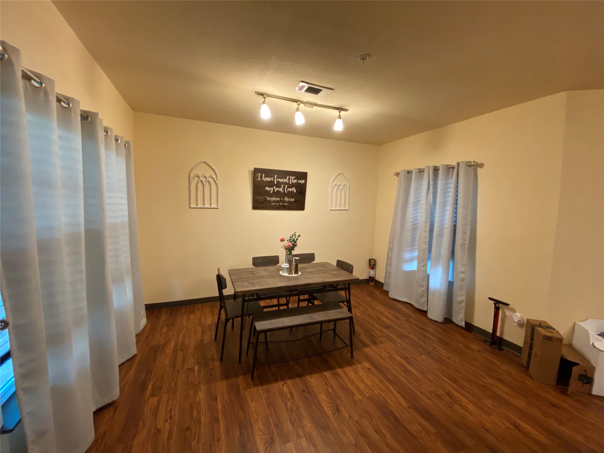 1239 20th Street, Unit B Huntsville, TX 77340 - Photo 10 of 17 a living room with furniture and a wooden floor