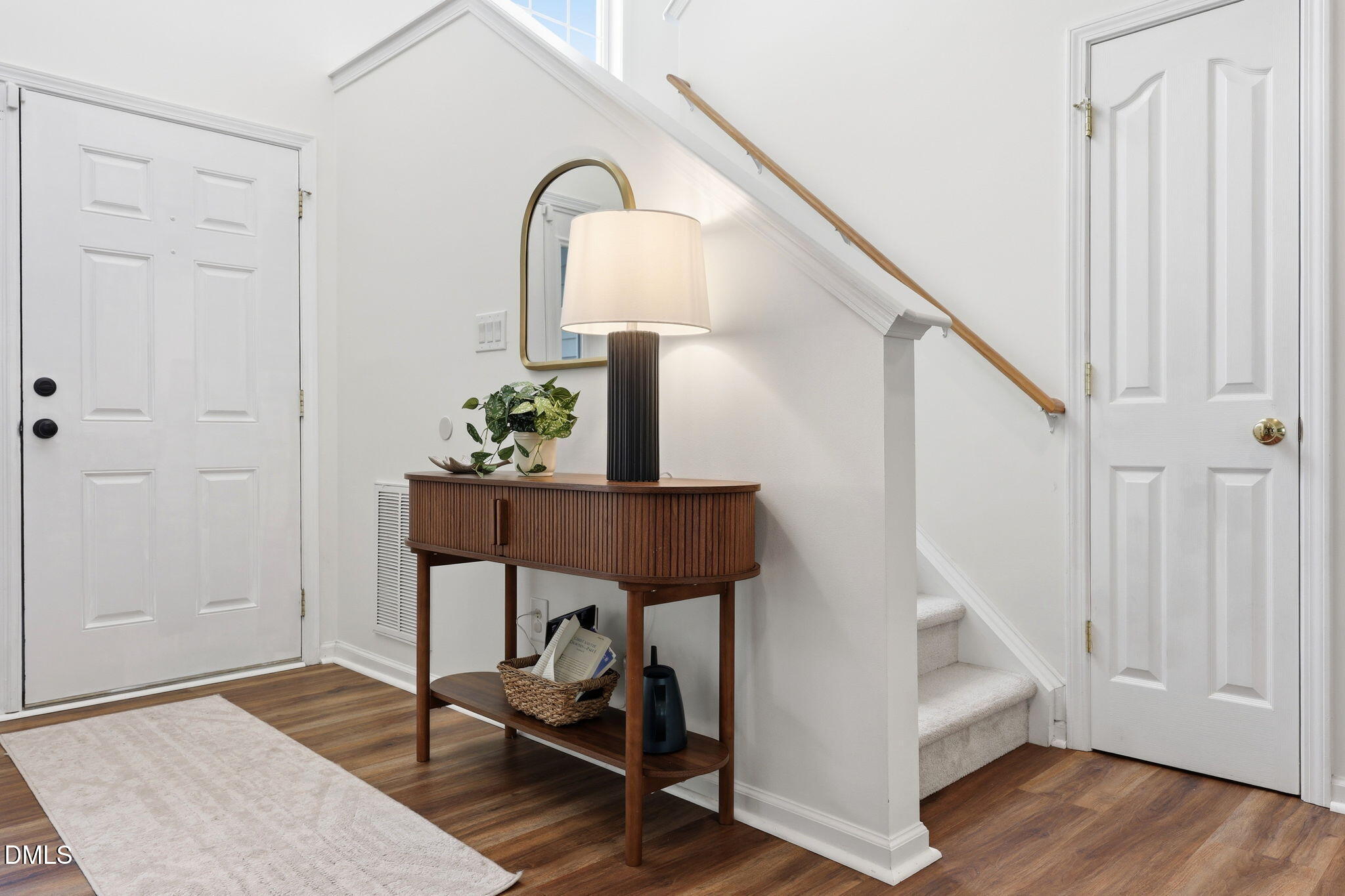 5629 Enoree Lane Raleigh, NC 27616 - Photo 5 of 38 a view of entryway and hall with wooden floor