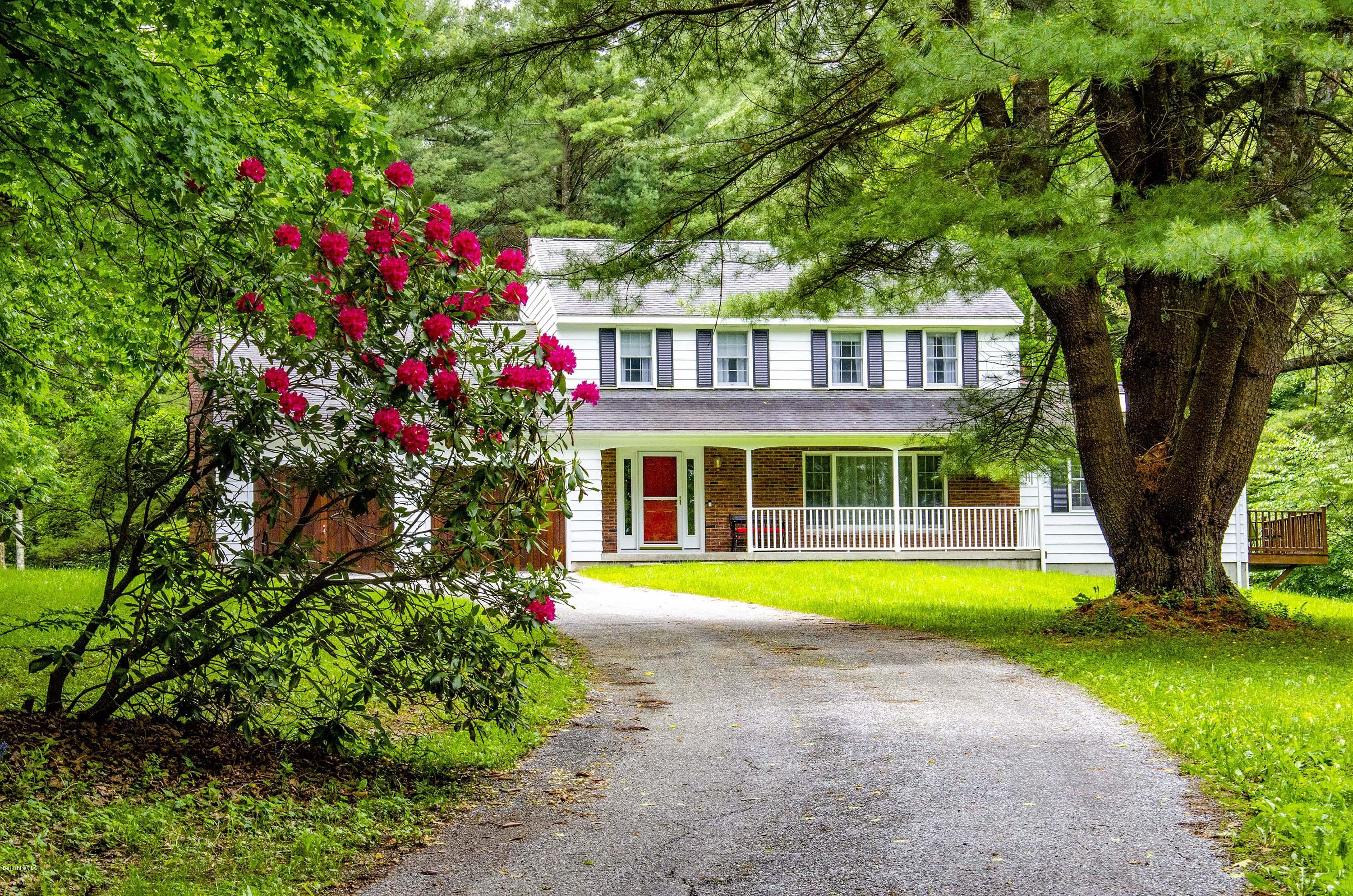 350 Lenox Road Richmond, MA 01254 - Photo 1 of 30 a front view of a house with a yard and trees