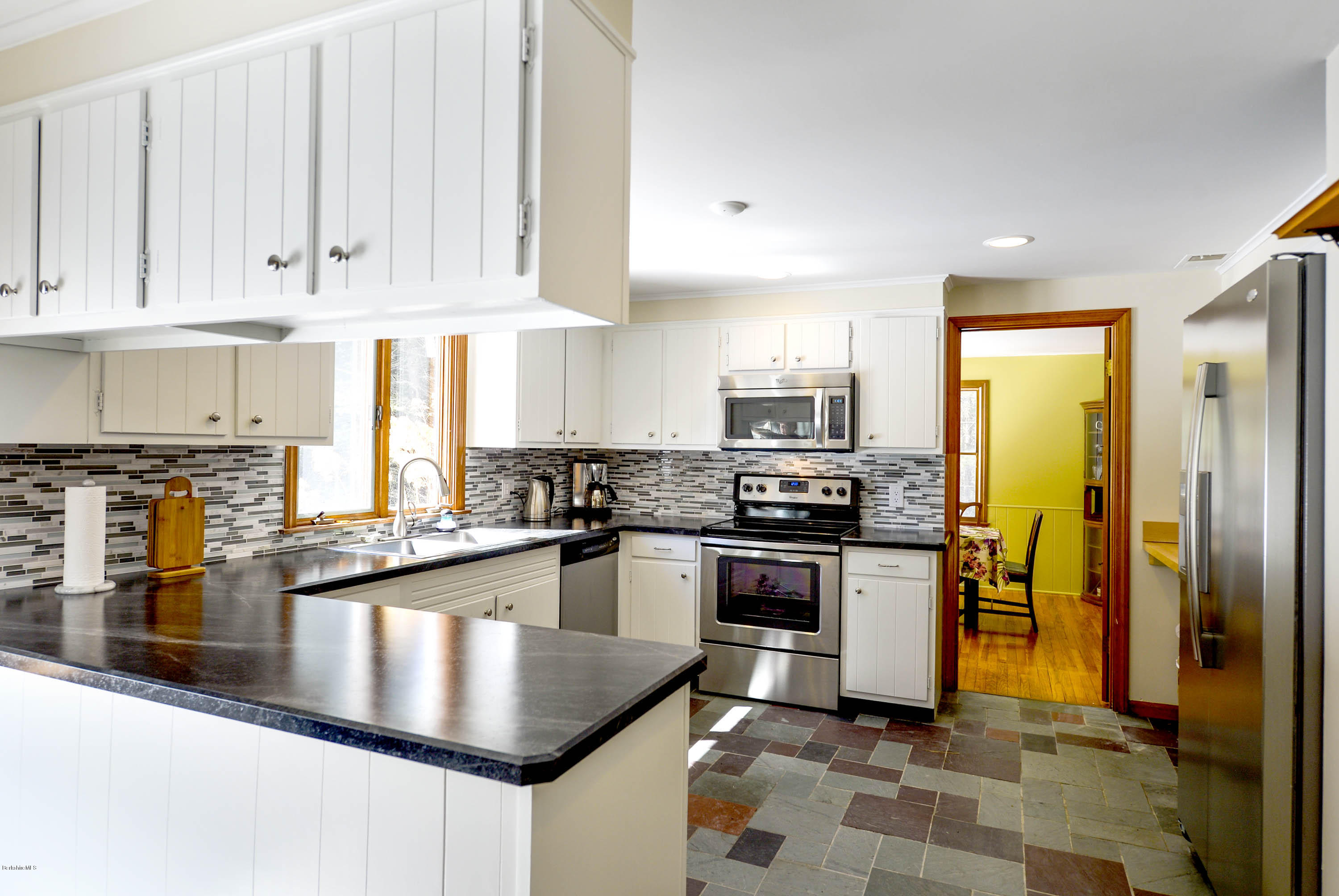 350 Lenox Road Richmond, MA 01254 - Photo 12 of 30 a kitchen with stainless steel appliances granite countertop a stove refrigerator and cabinets