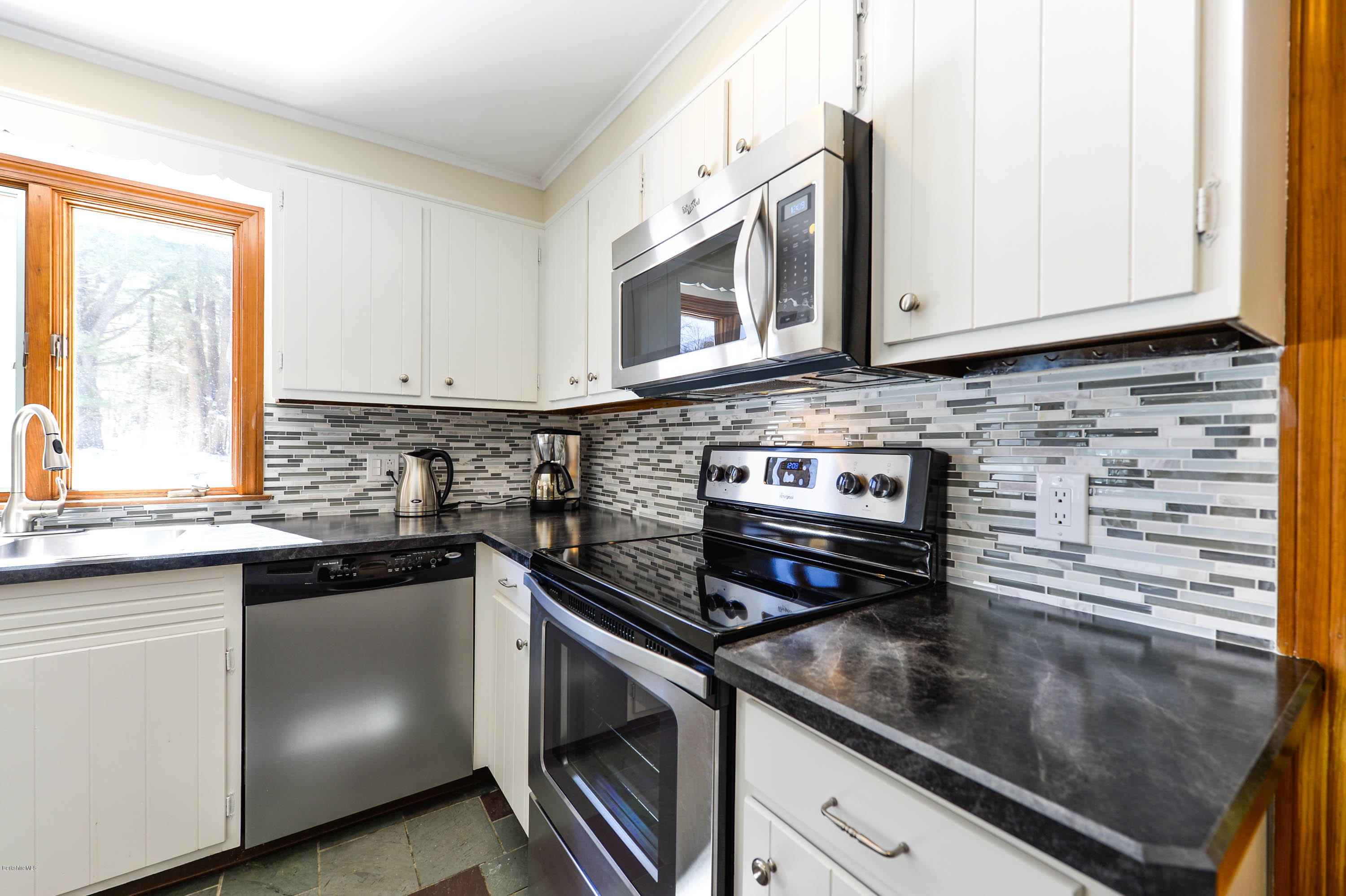 350 Lenox Road Richmond, MA 01254 - Photo 13 of 30 a kitchen with stainless steel appliances granite countertop a sink stove and microwave