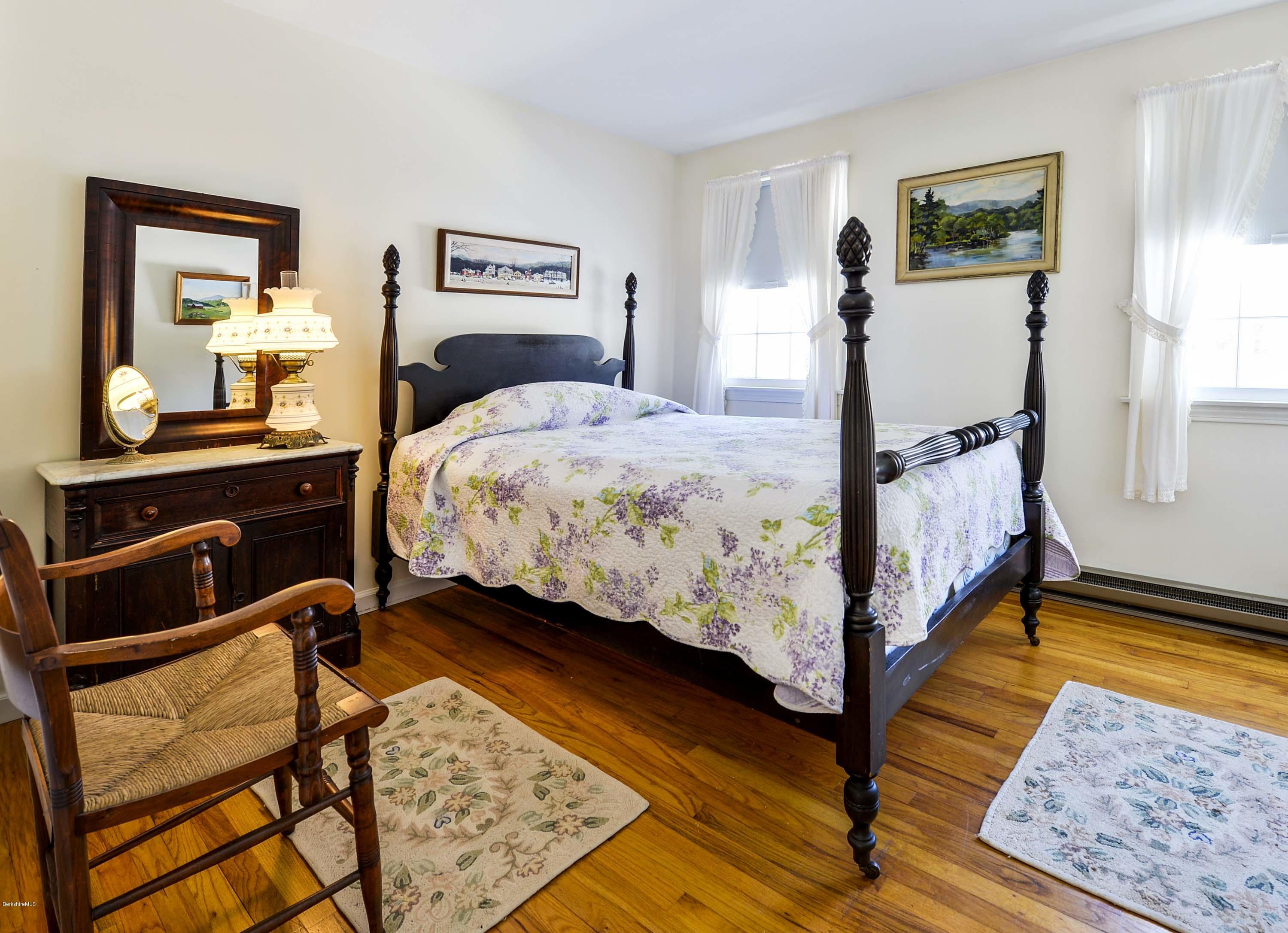 350 Lenox Road Richmond, MA 01254 - Photo 17 of 30 a bedroom with a bed and wooden floor