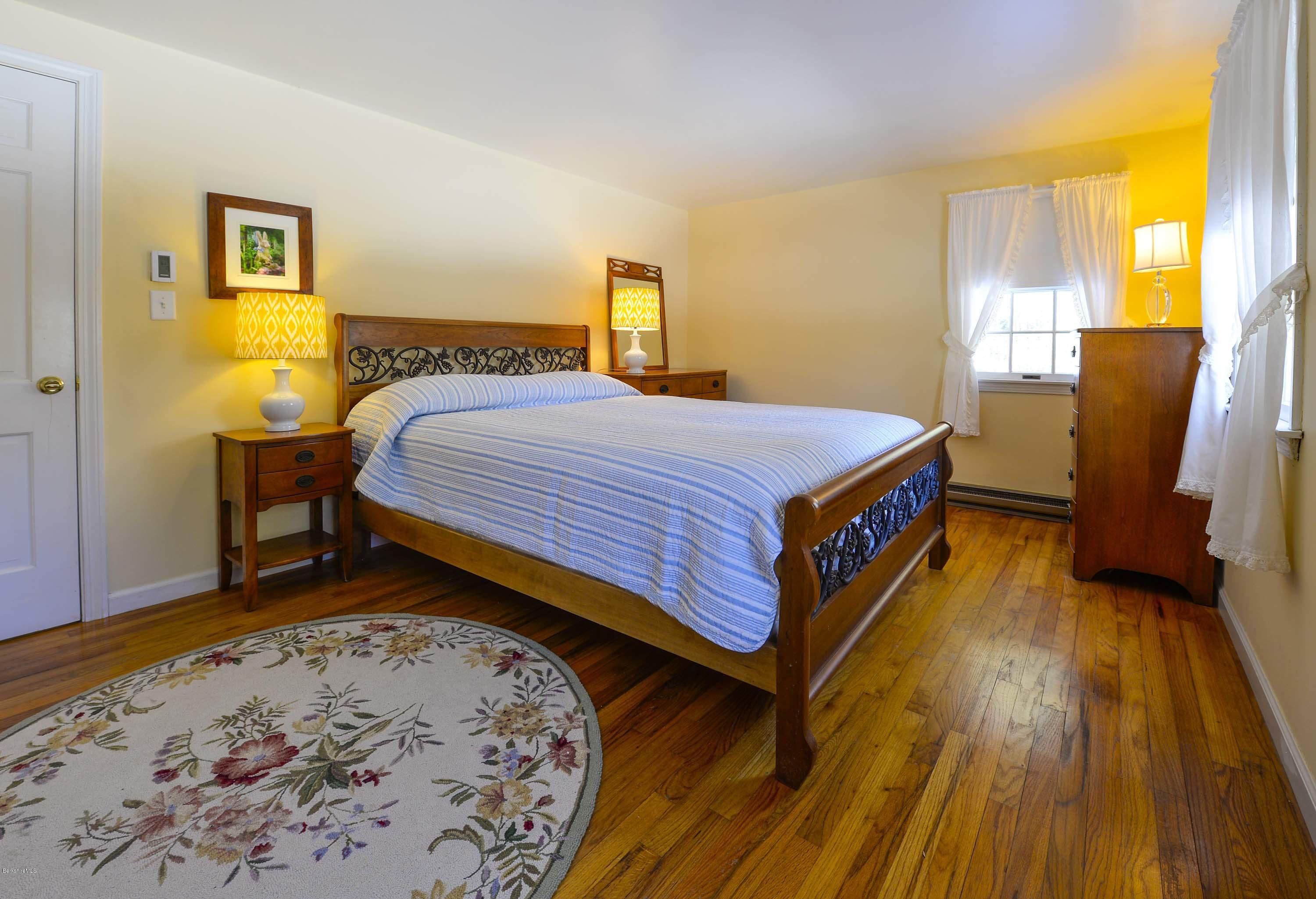 350 Lenox Road Richmond, MA 01254 - Photo 19 of 30 a bed room with a bed and a table