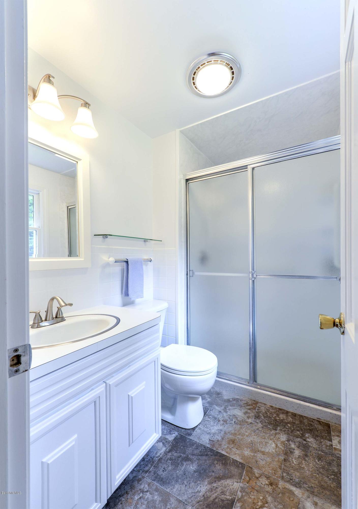 350 Lenox Road Richmond, MA 01254 - Photo 23 of 30 a bathroom with a sink a toilet and shower