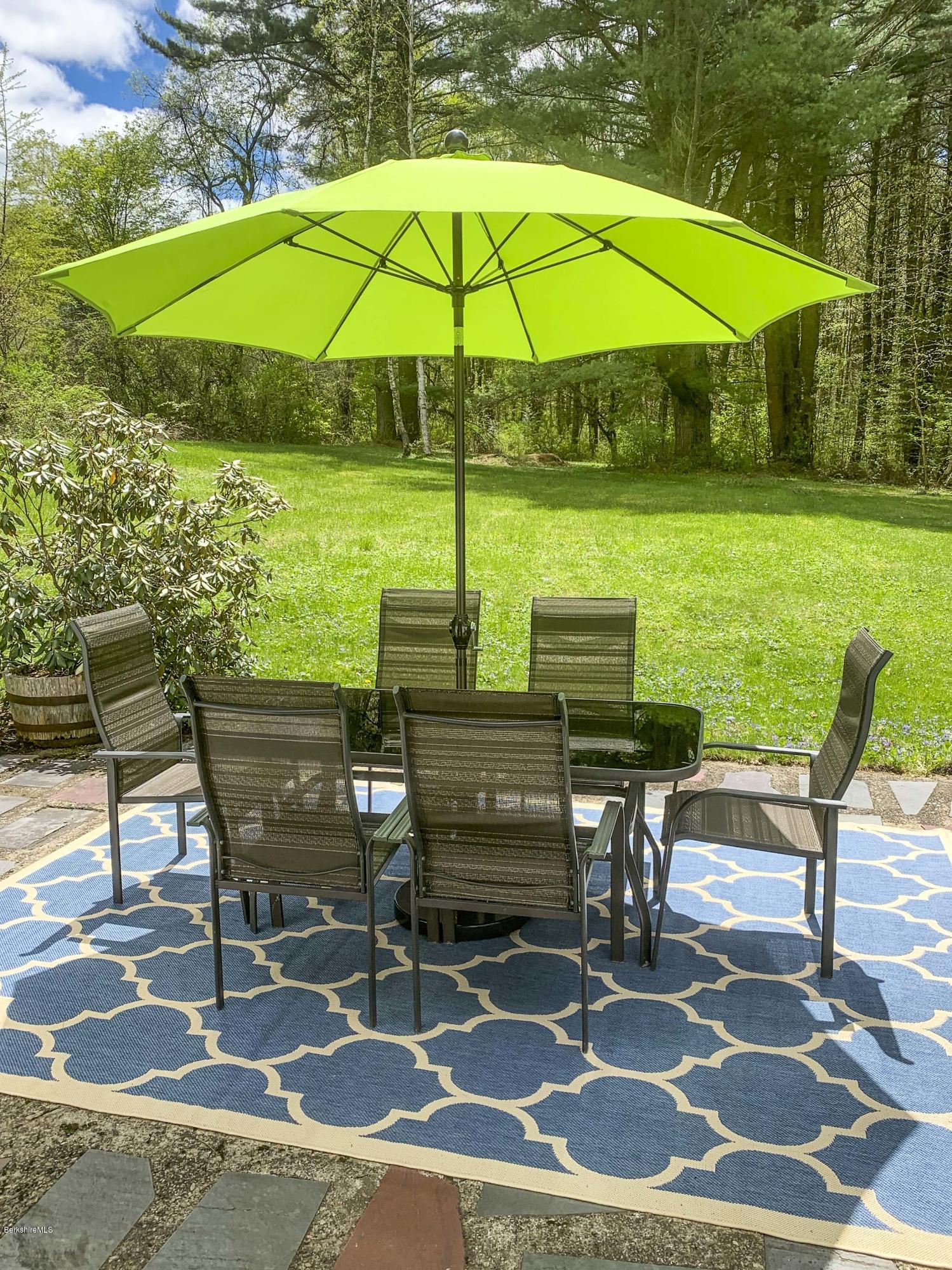 350 Lenox Road Richmond, MA 01254 - Photo 5 of 30 a view of a chairs and table in the yard