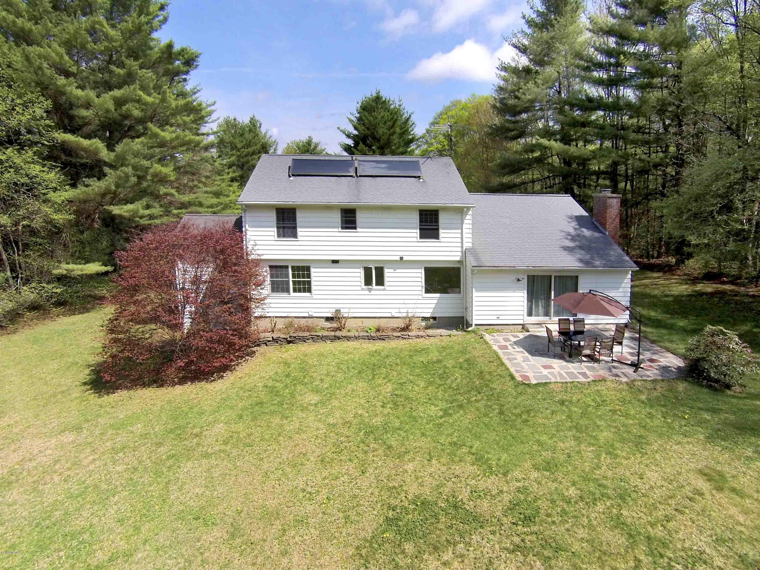 350 Lenox Road Richmond, MA 01254 - Photo 6 of 30 a view of a house with swimming pool and sitting area