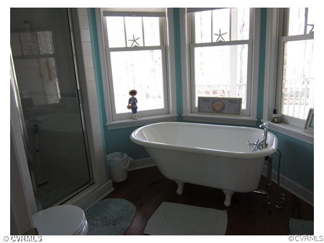 3240 Oak Hill Road Buckingham, VA 23921 - Photo 7 of 9 a white bath tub sitting next to a window