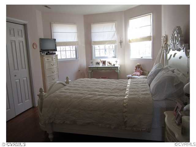 3240 Oak Hill Road Buckingham, VA 23921 - Photo 8 of 9 a bedroom with a bed and wooden floor