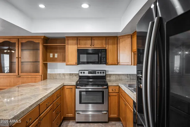 a kitchen with a stove and a refrigerator